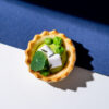 Cream of green peas, feta tarte basket
